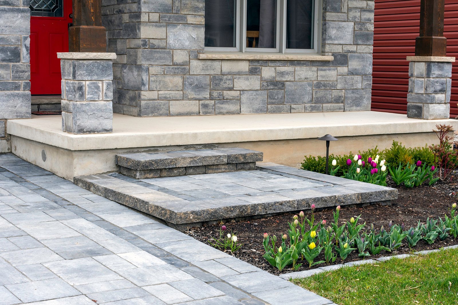 Closeup of front residential luxury landscaping for a smaller home.